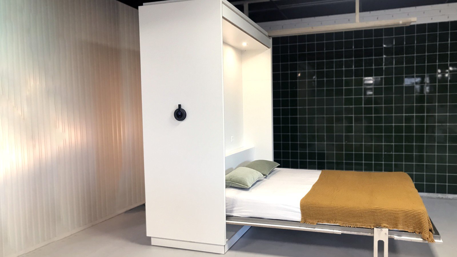 The flexible furniture wall: an innovative urban living project